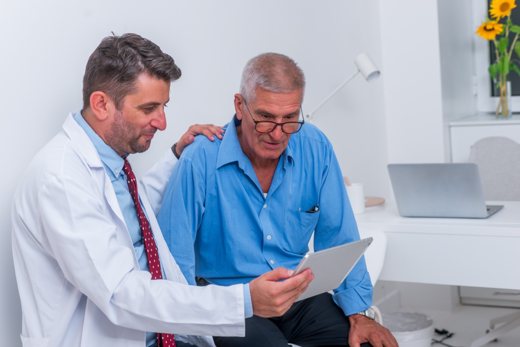 An Alleviate physician reviewing care with a senior patient